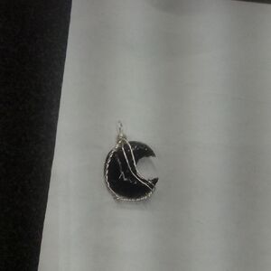 Elegant Black and Silver Crescent Pendant